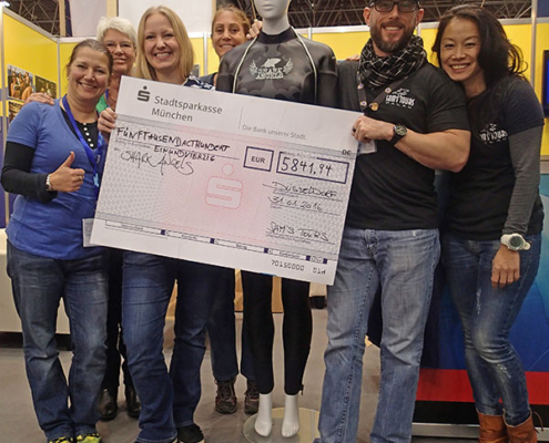 Charity promotion handing over check